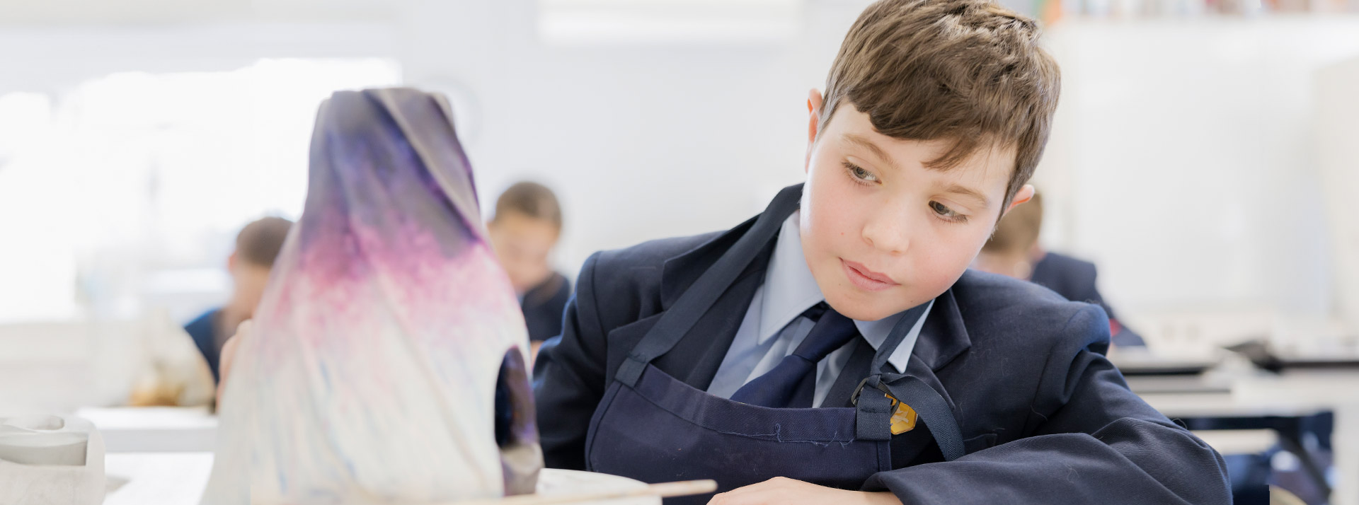 Student working on his art project in the classroom at St Columba’s Catholic College Springwood