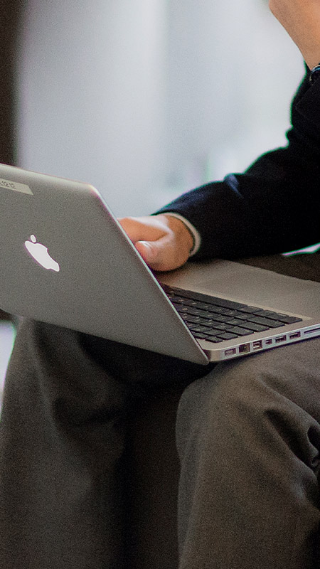 Student using his laptop in the classroom at St Columba’s Catholic College Springwood