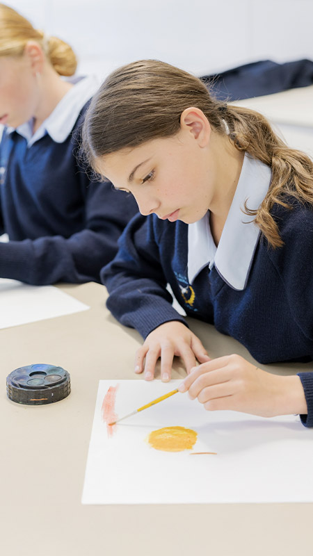 Students working on their artworks in the classroom at St Columba’s Catholic College Springwood