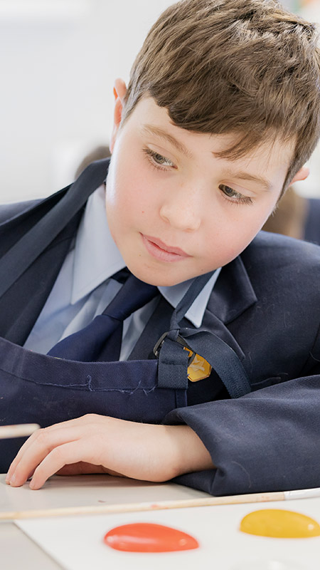Student working on his artwork in the classroom at St Columba’s Catholic College Springwood