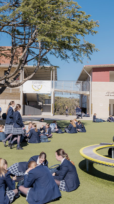 Students having lunch on the school grounds at St Columba’s Catholic College Springwood