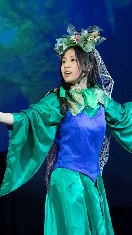 Student performing in a school performance at St Columba’s Catholic College Springwood