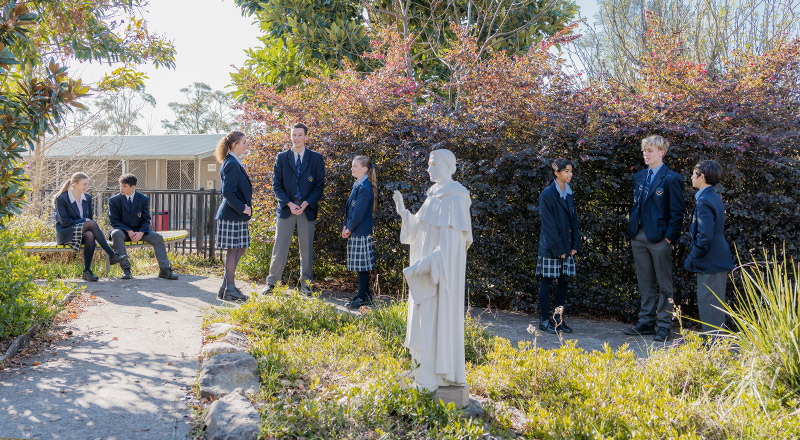 Students standing in the school garden at St Columba’s Catholic College Springwood